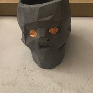 Geometric Gray Skull Planter with Gold Accents